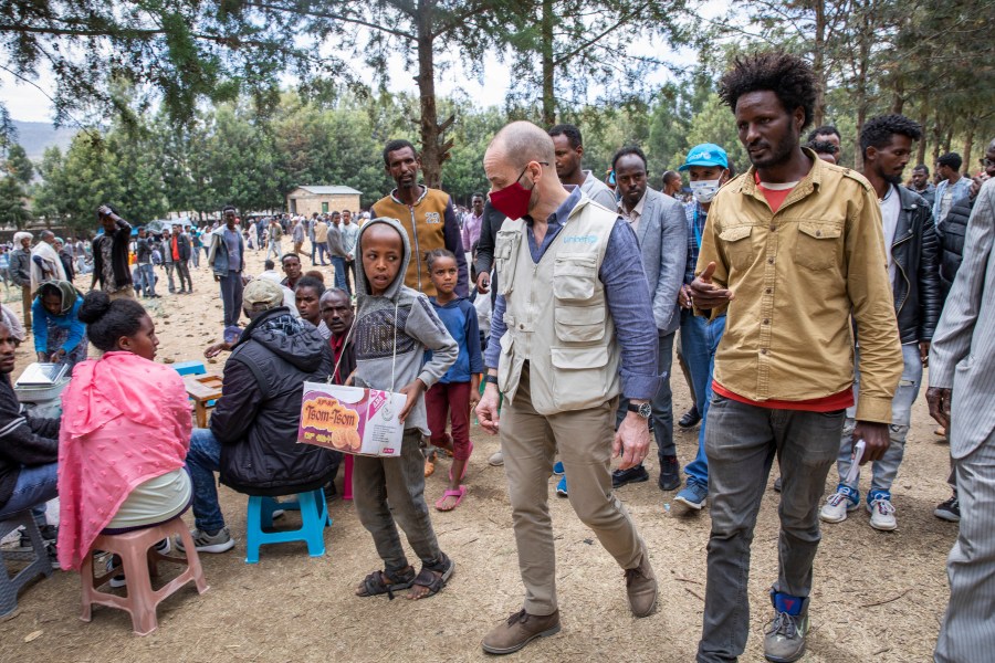 Manuel Fontaine, UNICEF Director of the Office of Emergency Programmes, center, visits internally-displaced people in Adigrat Town, in the Tigray region of northern Ethiopia Monday, Feb. 22, 2021. (Zerihun Sewunet/UNICEF via AP)