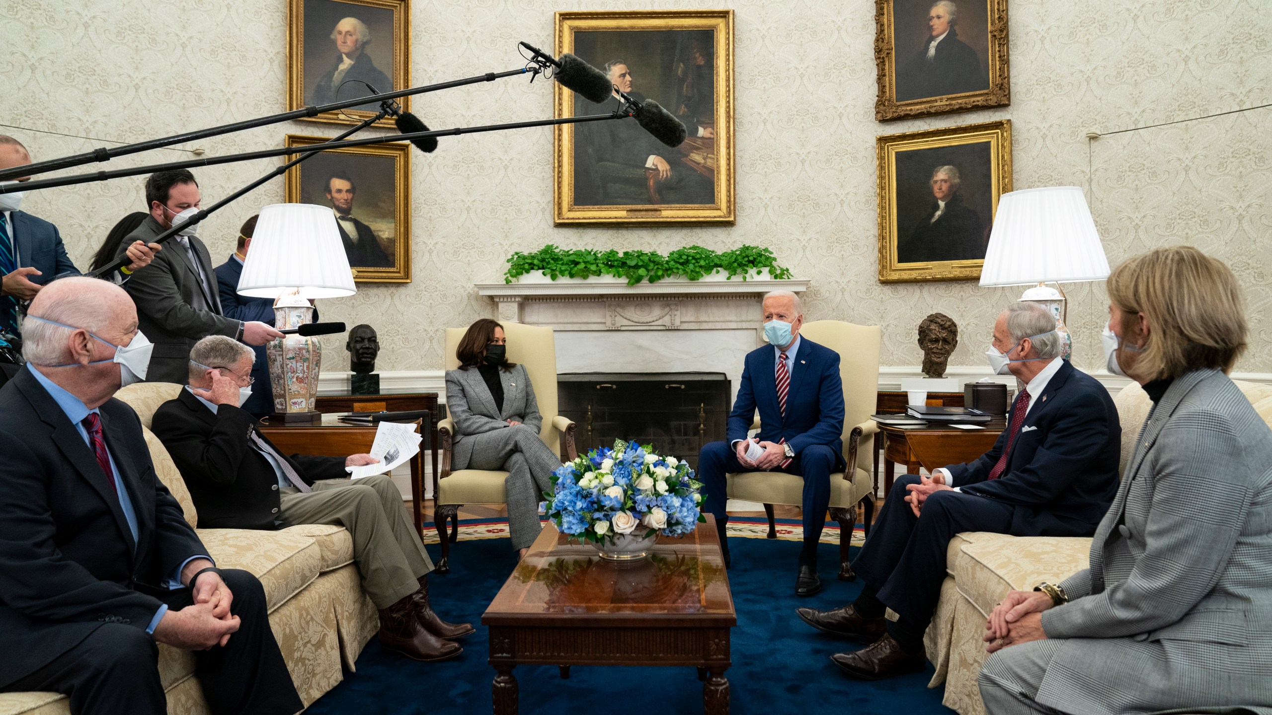 In this Feb. 11, 2021, file photo President Joe Biden speaks during a meeting with lawmakers on investments in infrastructure, in the Oval Office of the White House in Washington. From left, Sen. Ben Cardin, D-Md., Sen. Jim Inhofe, R-Okla., Vice President Kamala Harris, Biden, Sen. Tom Carper, D-Del., and Sen. Shelley Moore Capito, R-W.Va. Looking beyond the $1.9 trillion COVID relief bill, Biden and lawmakers are laying the groundwork for another of his top legislative priorities — a long-sought boost to the nation's roads, bridges and other infrastructure that could meet GOP resistance to a hefty price tag. (AP Photo/Evan Vucci, File)