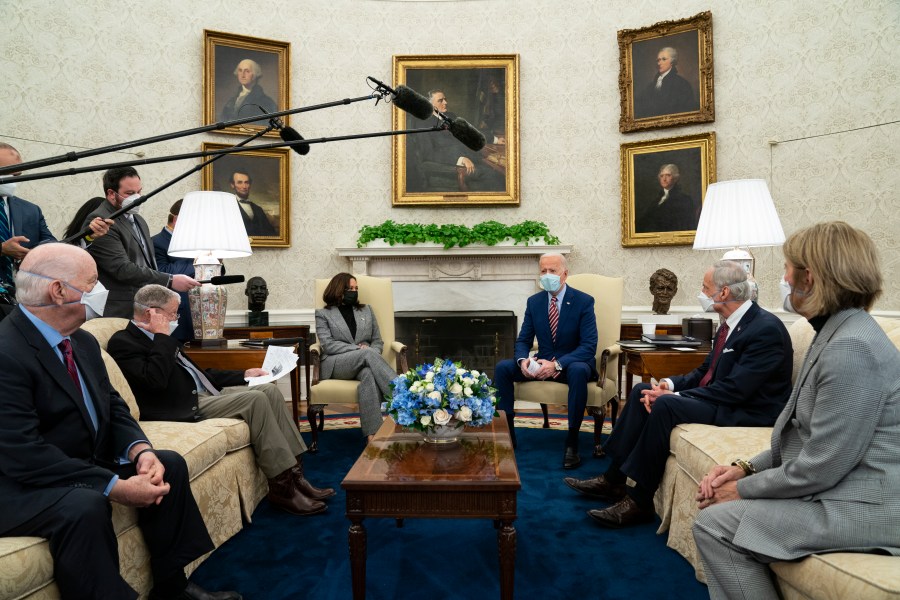 In this Feb. 11, 2021, file photo President Joe Biden speaks during a meeting with lawmakers on investments in infrastructure, in the Oval Office of the White House in Washington. From left, Sen. Ben Cardin, D-Md., Sen. Jim Inhofe, R-Okla., Vice President Kamala Harris, Biden, Sen. Tom Carper, D-Del., and Sen. Shelley Moore Capito, R-W.Va. Looking beyond the $1.9 trillion COVID relief bill, Biden and lawmakers are laying the groundwork for another of his top legislative priorities — a long-sought boost to the nation's roads, bridges and other infrastructure that could meet GOP resistance to a hefty price tag. (AP Photo/Evan Vucci, File)