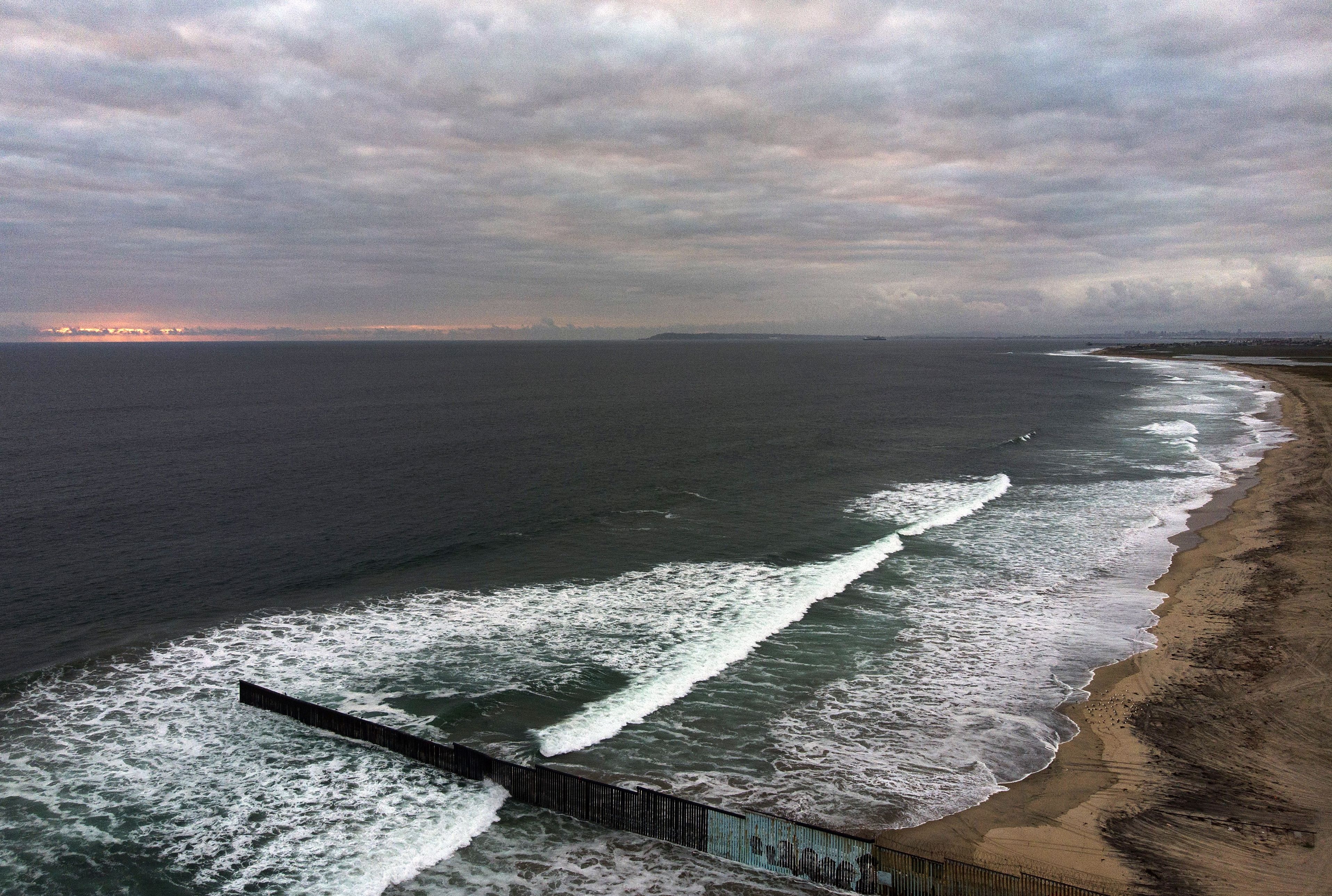 Aerial view of the Mexico-U.S. fence is seen in Playas de Tijuana, Baja California State, in the Pacific coast of Mexico, taken on June 5, 2020. (GUILLERMO ARIAS/AFP via Getty Images)