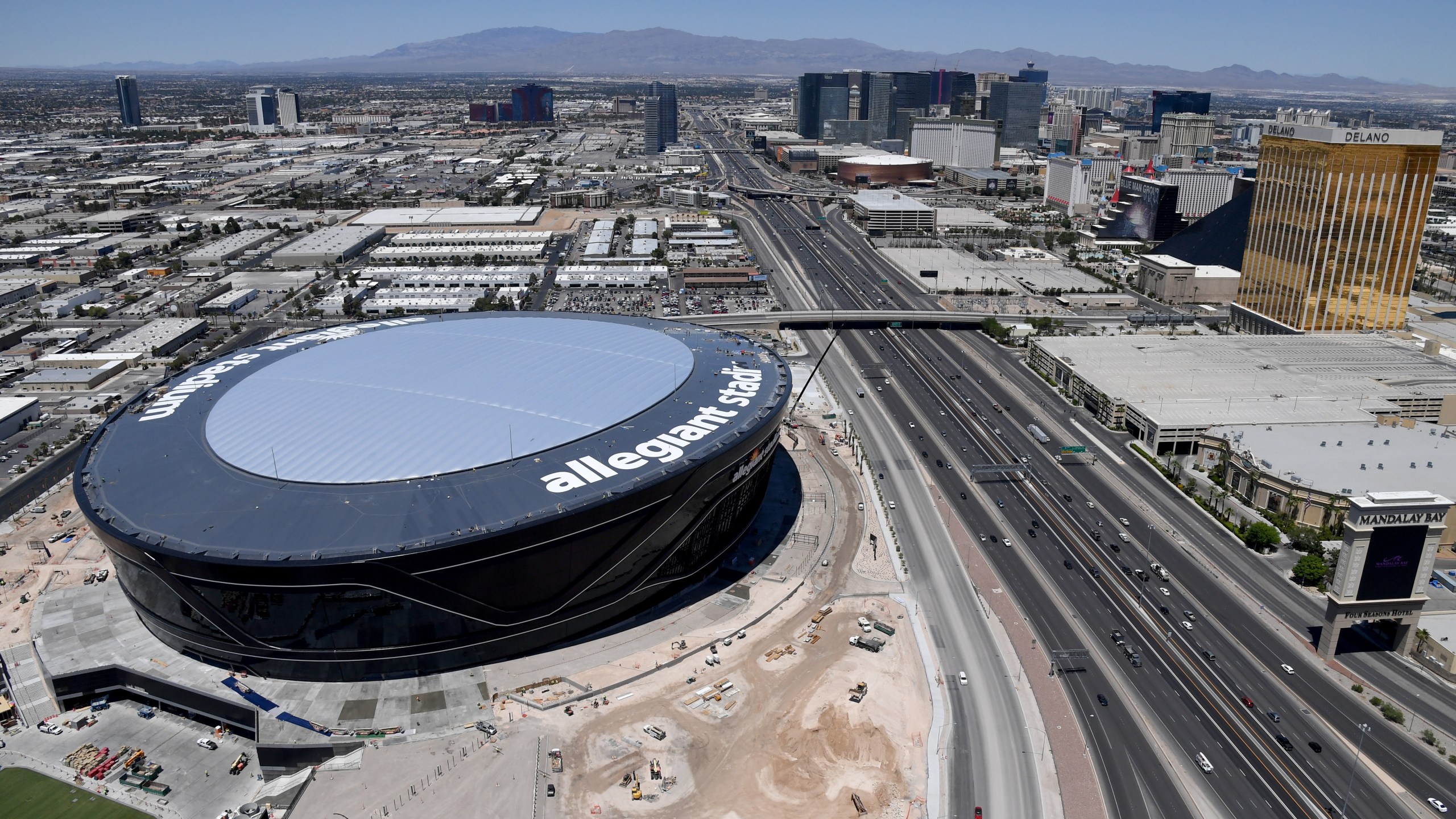 An aerial view shows hotel-casinos on the Las Vegas Strip east of the construction continuing at Allegiant Stadium on May 21, 2020 in Las Vegas, Nevada. (Ethan Miller/Getty Images)