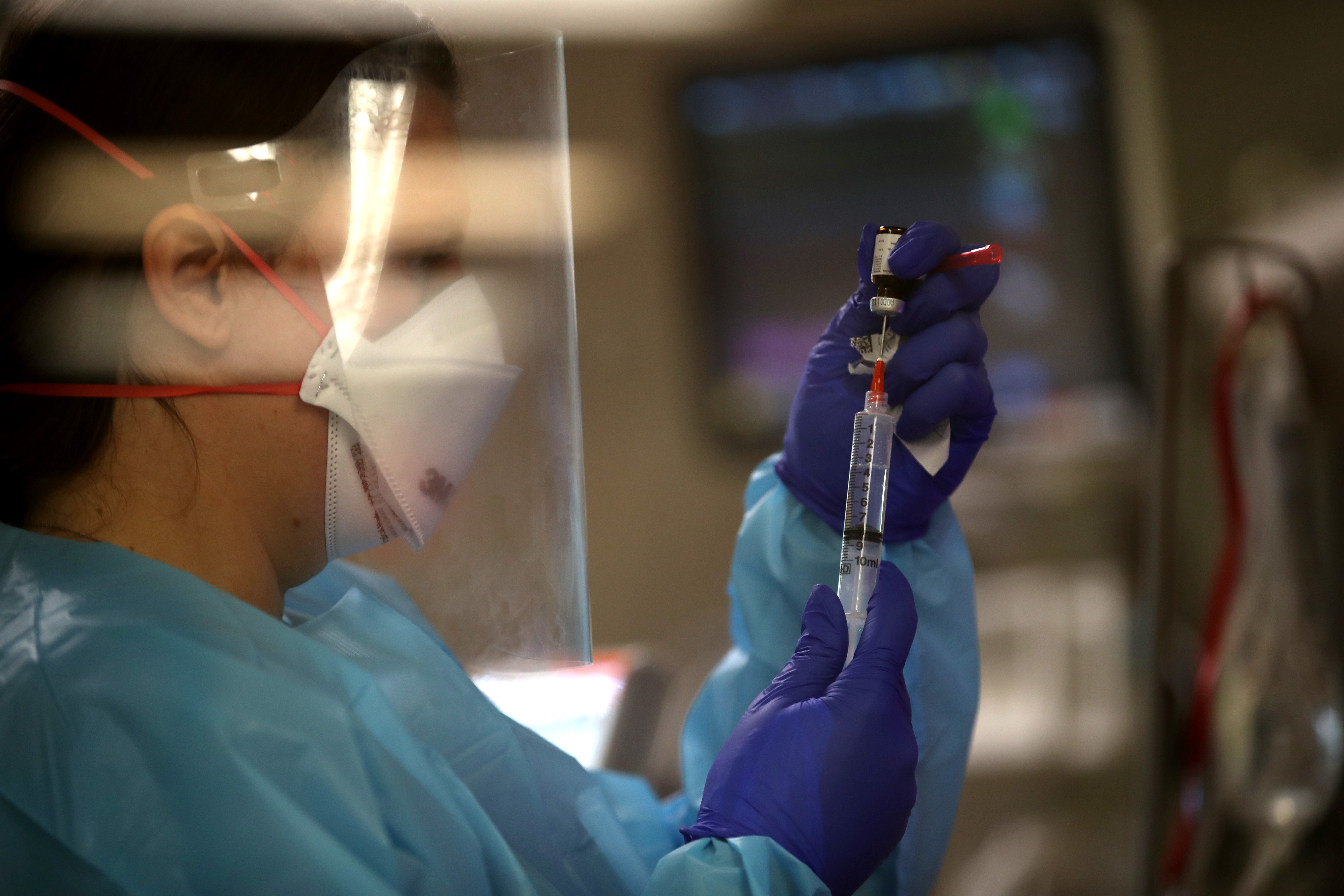 A nurse prepares medication as she cares for a coronavirus COVID-19 patient in the intensive care unit at Regional Medical Center on May 21, 2020 in San Jose, California. Frontline workers are continuing to care for coronavirus COVID-19 patients throughout the San Francisco Bay Area. Santa Clara county, where this hospital is located, has had the most deaths of any Northern California county, and the earliest known COVID-19 related deaths in the United States. (Photo by Justin Sullivan/Getty Images)