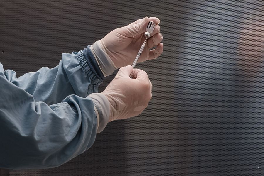 A pharmacy technician prepares Pfizer's COVID-19 vaccine before it is administered to healthcare workers at Rady Children's Hospital in San Diego on Dec. 15, 2020. (ARIANA DREHSLER/AFP via Getty Images)