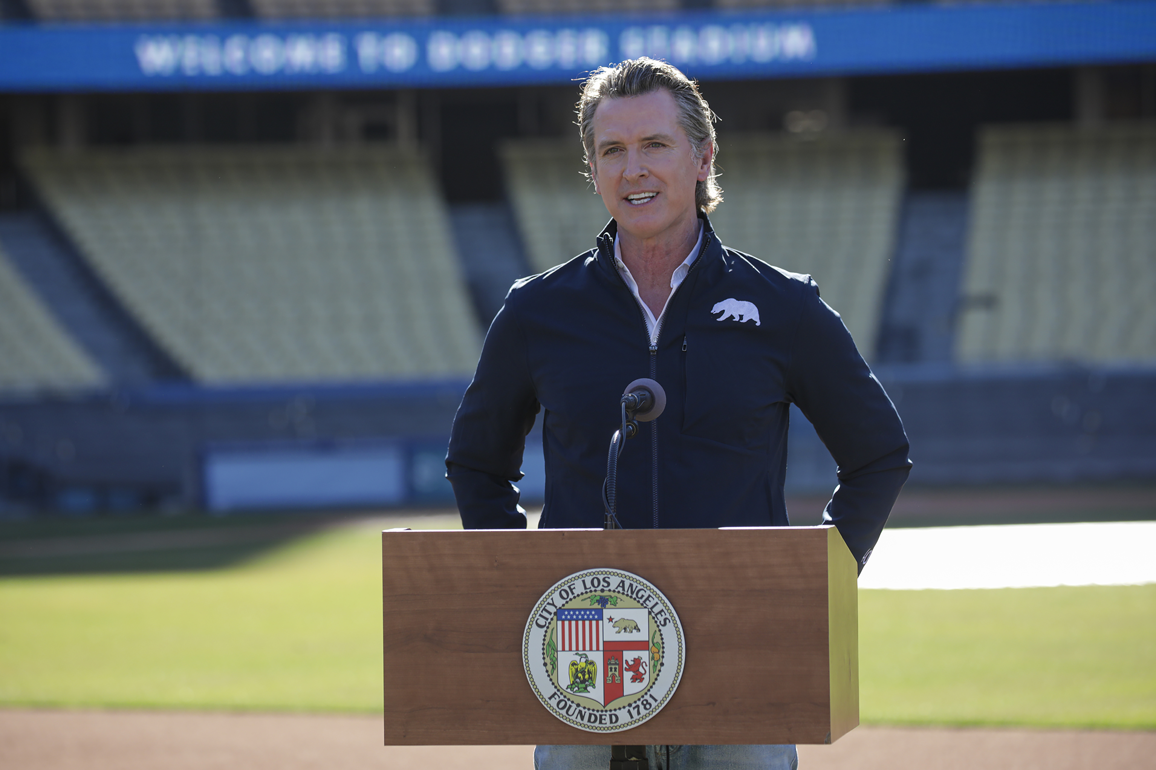 California Gov. Gavin Newsom addresses a press conference held at the launch of mass COVID-19 vaccination site at Dodger Stadium on Jan. 15, 2021 in Los Angeles. (Irfan Khan / POOL / AFP via Getty Images)