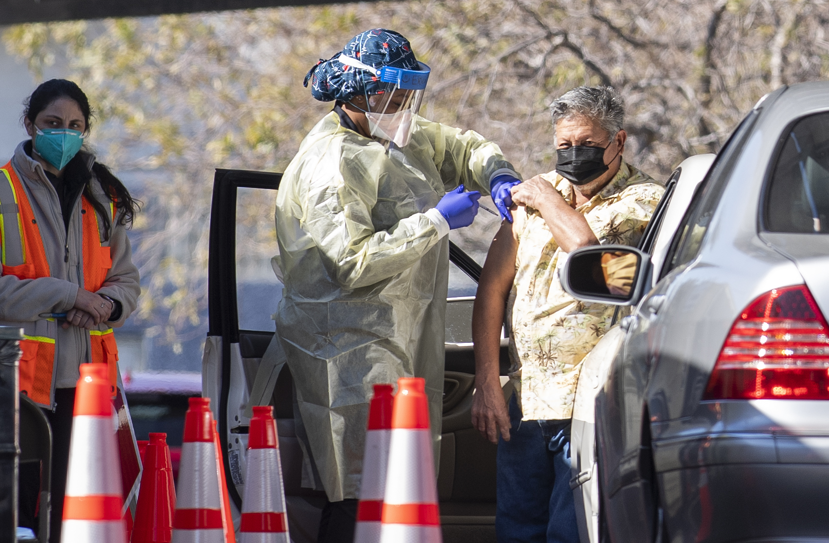 A nurse gives a COVID-19 vaccine shot to a patient at CSUN Covid-19 vaccination center in Northridge, California on Feb. 2, 2021. (VALERIE MACON/AFP via Getty Images)