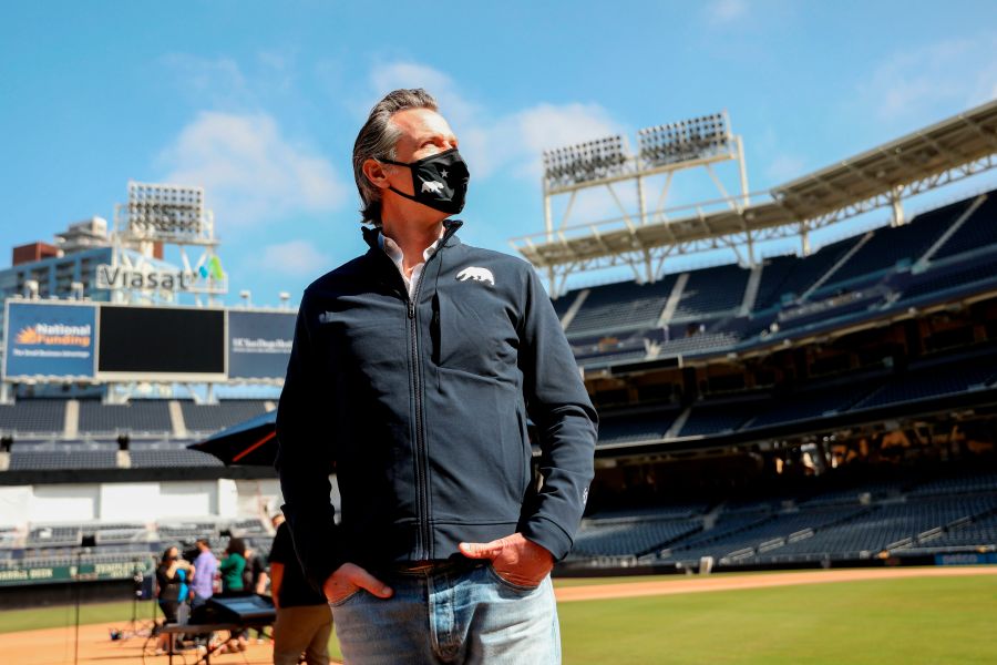 California Gov. Gavin Newsom looks on before speaking to members of the media during a press conference at Petco Park, February 8, 2021 in San Diego. (SANDY HUFFAKER/POOL/AFP via Getty Images)