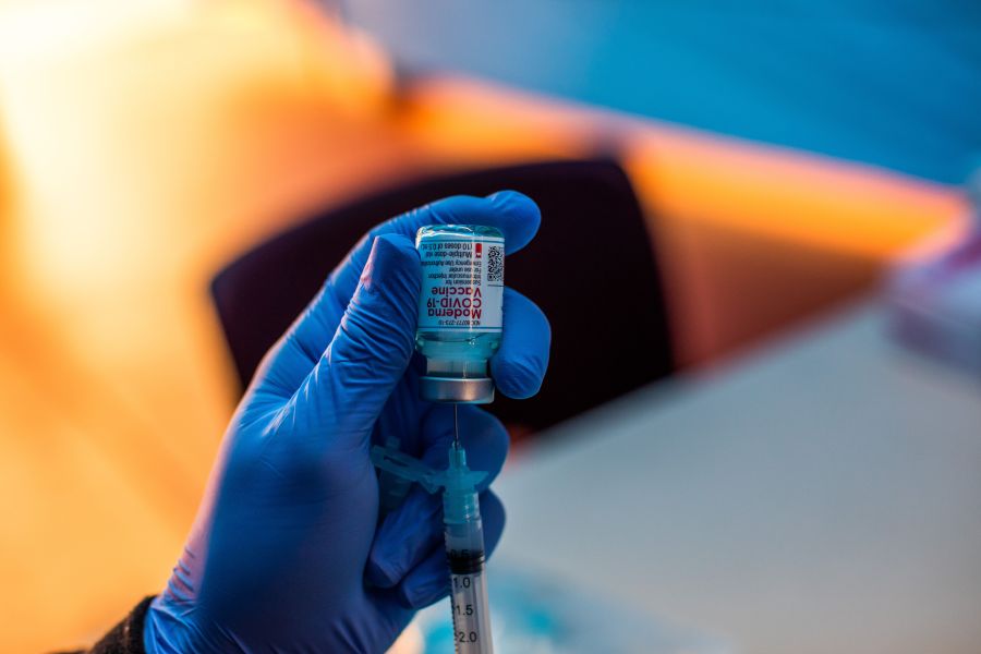 Medical workers load syringes with the Moderna Covid-19 vaccine to be administered by nurses at a vaccination site at Kedren Community Health Center, in South Central Los Angeles, California on February 16, 2021. (Apu Gomes/AFP via Getty Images)