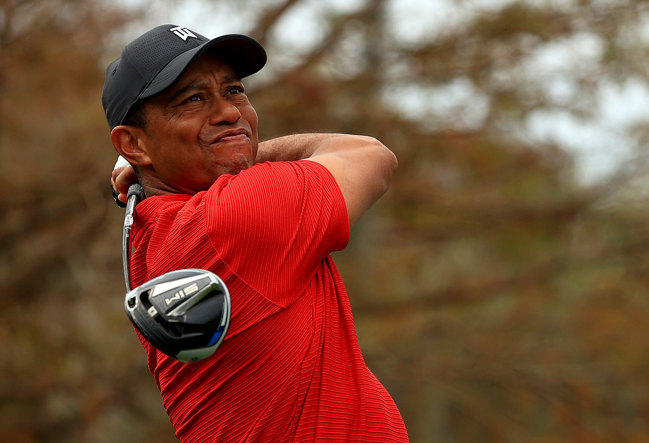 Tiger Woods hits his tee shot on the 15th hole during the final round of the PNC Championship at the Ritz Carlton Golf Club in Orlando, Florida, on Dec. 20, 2020. (Mike Ehrmann / Getty Images)