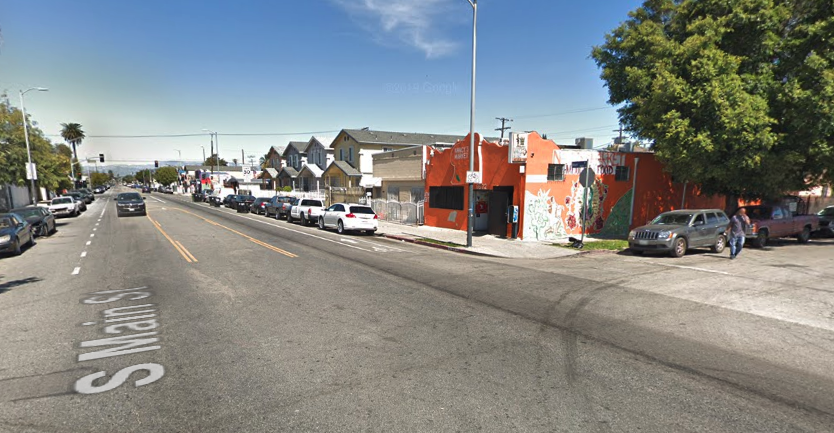 The intersection of Main and 97th Streets is shown in a Street View image from Google Maps.