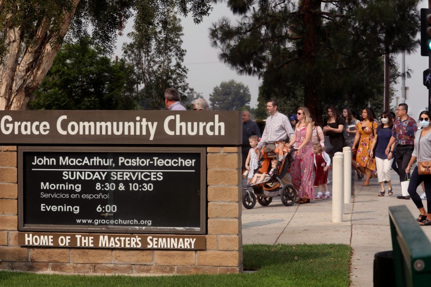 Grace Community Church attendees make their way to Sunday service in Sun Valley in September. The church has held indoor morning services since late July in defiance of L.A. County public health orders. (Genaro Molina / Los Angeles Times)