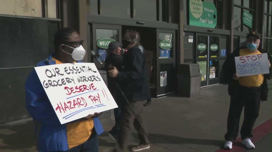 Protesters stage a rally on Feb. 3, 2021 in support of hazard pay outside a Long Beach Food 4 Less that Kroger planned to close in April. (KTLA)