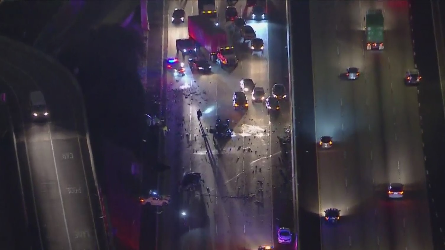 Authorities respond to the scene of a multivehicle crash that shut down the northbound 110 Freeway in Carson on Feb. 8, 2021. (KTLA)