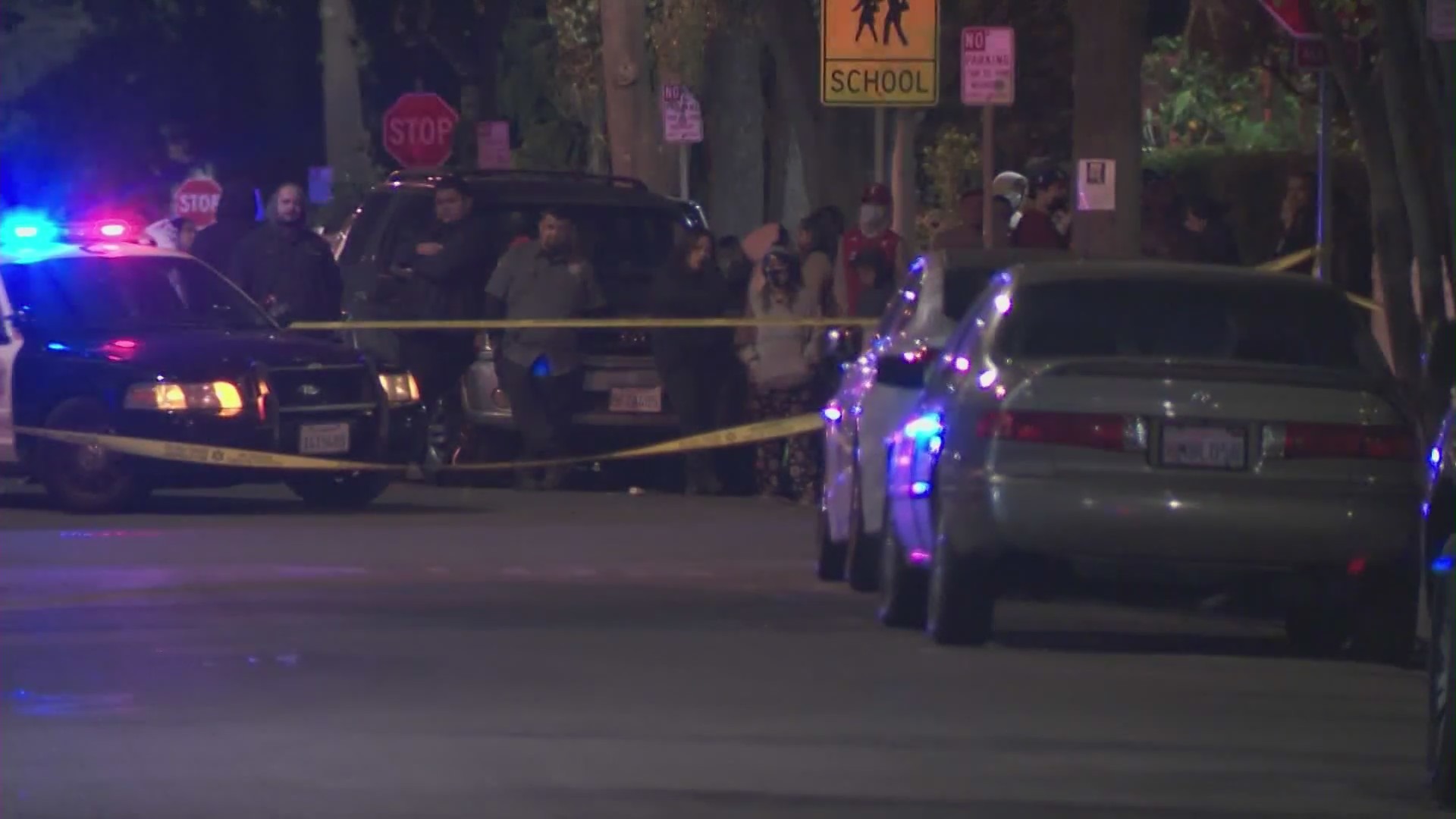 Investigators respond to a fatal shooting in Maywood on Feb. 14, 2021. (KTLA)