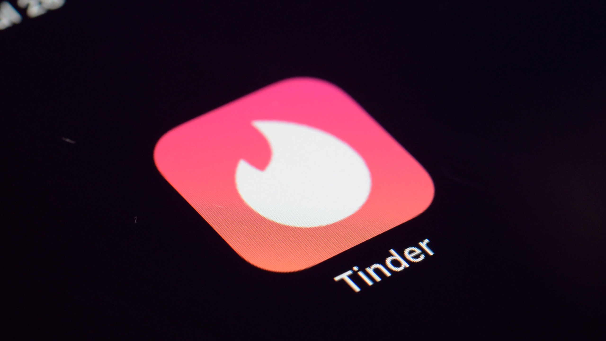 This Tuesday, July 28, 2020 photo shows the icon for the Tinder dating app on a device in New York. (AP Photo/Patrick Sison)