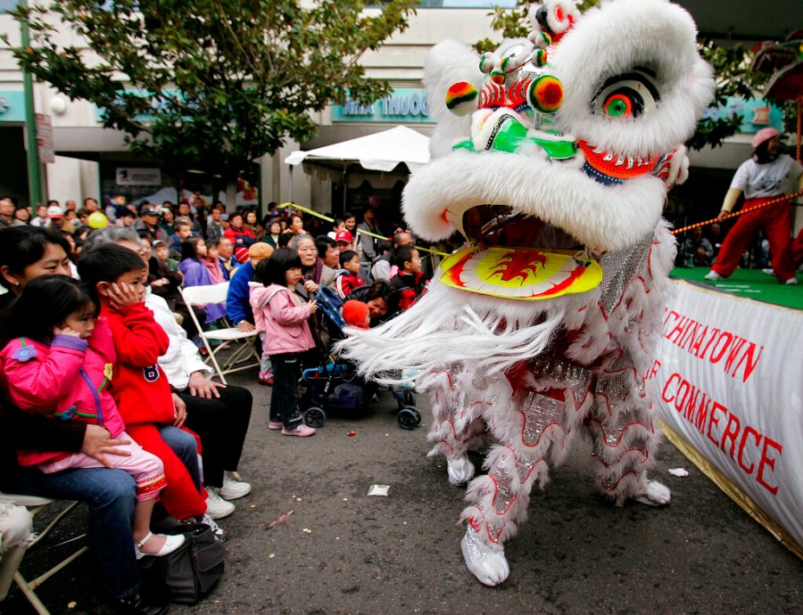 In this Jan. 21, 2006, file photo, Chinese lion dancers perform in Oakland's Chinatown. (AP Photo/Paul Sakuma, File)