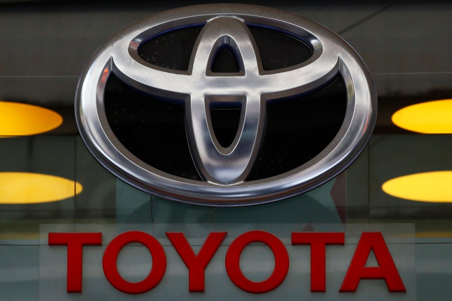 In this Sept. 20, 2017, file photo the Toyota logo is displayed at their shop on the Champs Elysees Avenue in Paris. The U.S. government is investigating complaints of engine compartment fires in nearly 1.9 million Toyota RAV4 small SUVs. The National Highway Traffic Safety Administration began investigating after getting 11 fire complaints involving the 2013 through 2018 model years. (AP Photo/Francois Mori, File)