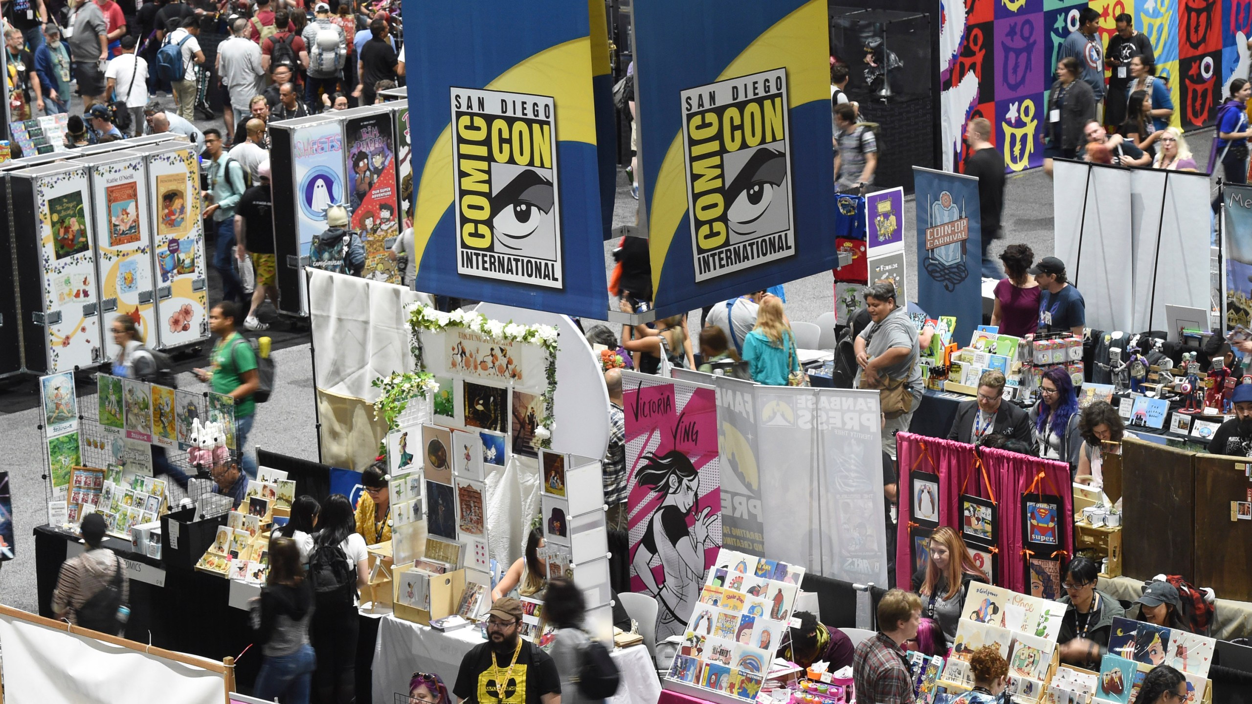 Comic-Con attendees walk the convention center floor during preview night at Comic-Con International on July 17, 2019, in San Diego, Calif. (Chris Pizzello/Invision/AP)