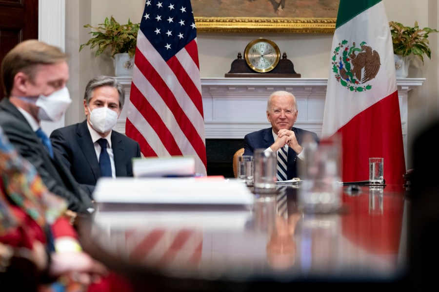 President Joe Biden, accompanied by White House national security adviser Jake Sullivan, left, and Secretary of State Antony Blinken, second from left, attends a virtual meeting with Mexican President Andres Manuel Lopez Obrador, in the Roosevelt Room of the White House, Monday, March 1, 2021, in Washington. (AP Photo/Andrew Harnik)