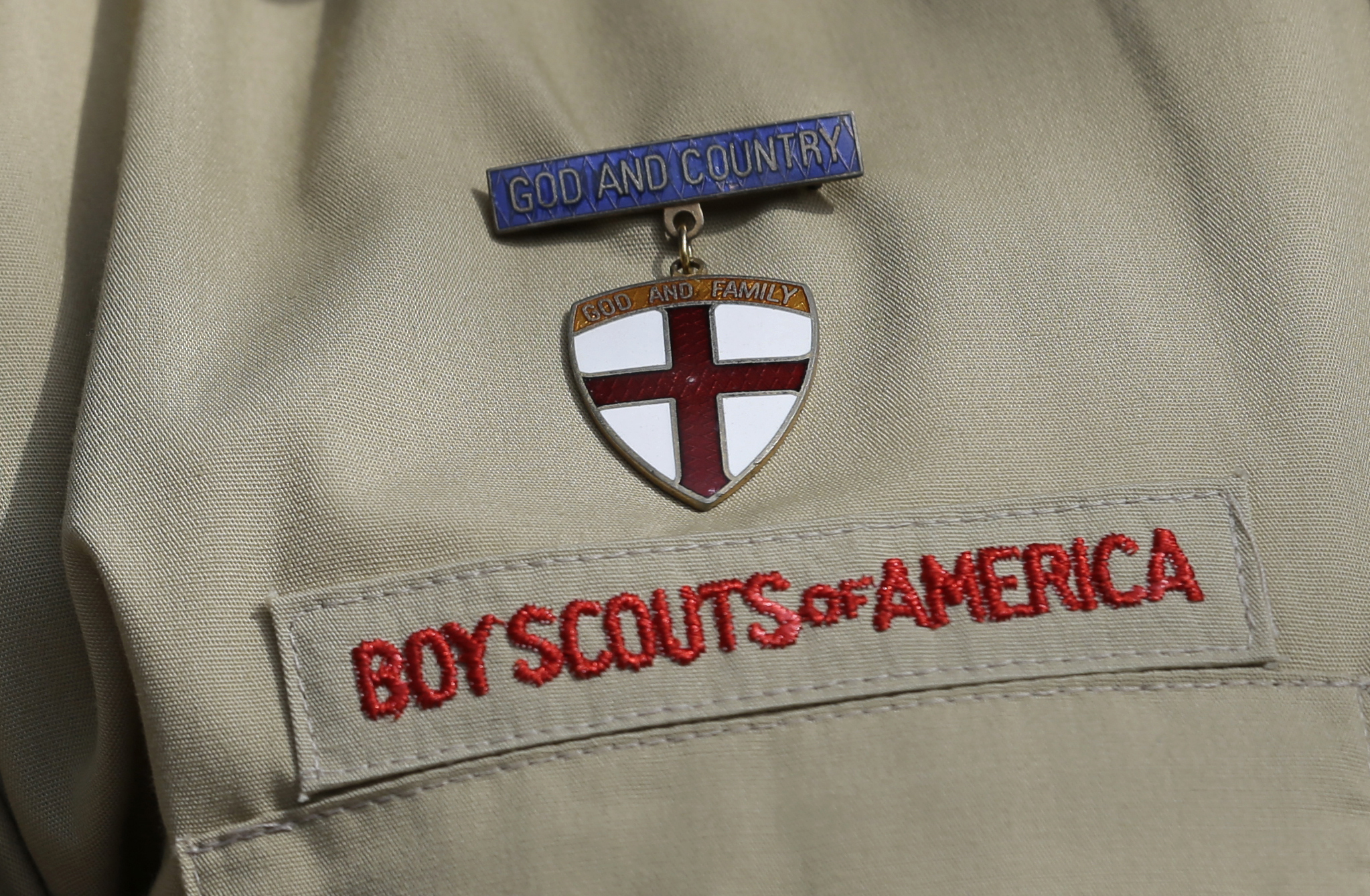 A detail of a Boy Scout uniform is seen during a news conference in front of the Boy Scouts of America headquarters in Irving, Texas, on Feb. 4, 2013. (Tony Gutierrez / Associated Press)