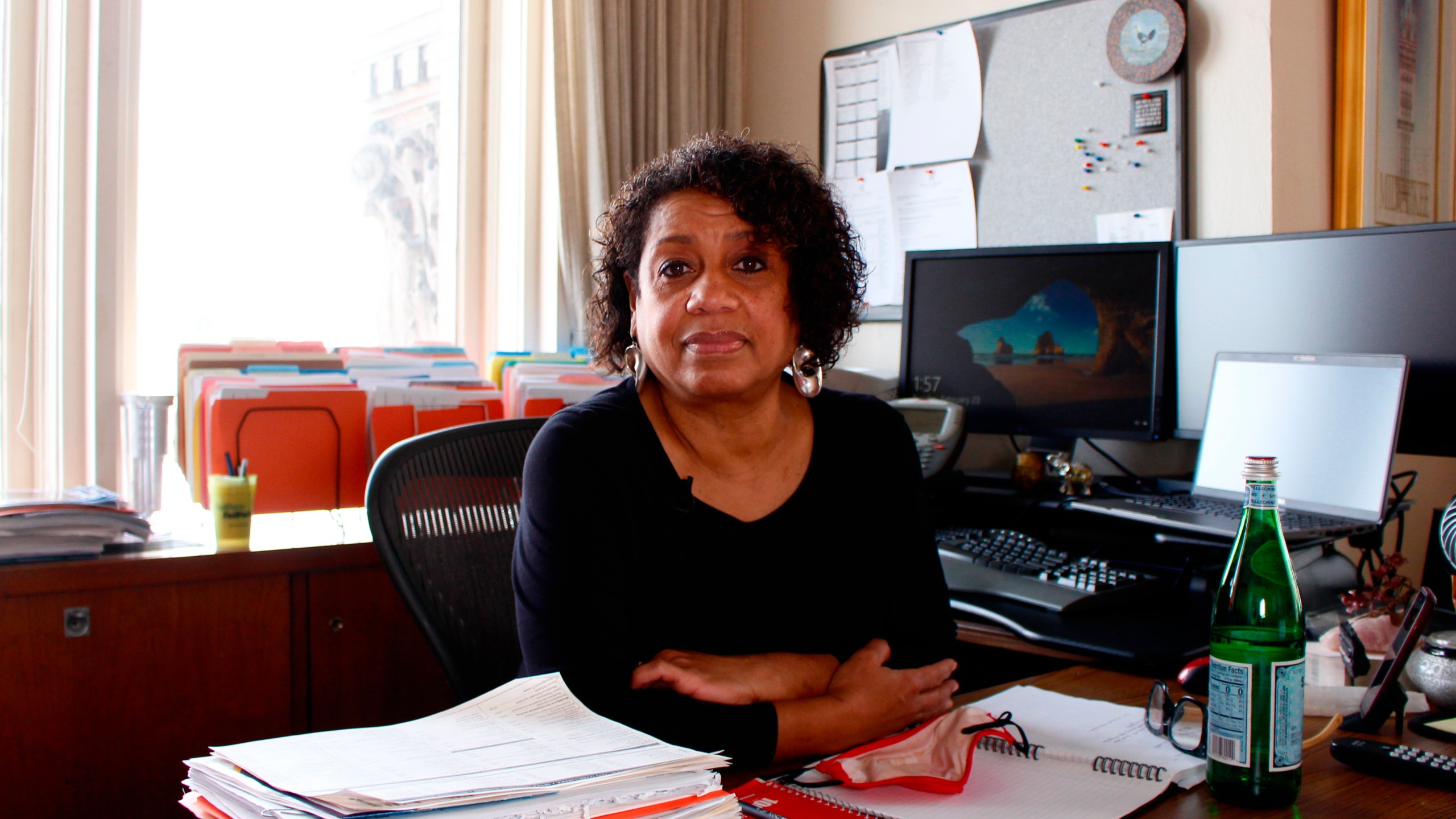 Kimberly Montgomery sits for a photo in her office in City Hall on Feb. 23, 2020, in Milwaukee. Montgomery lost 15 people in her life to COVID-19. "I don't know if I ever will ever be able to process all of them," she said. (AP Photo/Carrie Antlfinger)