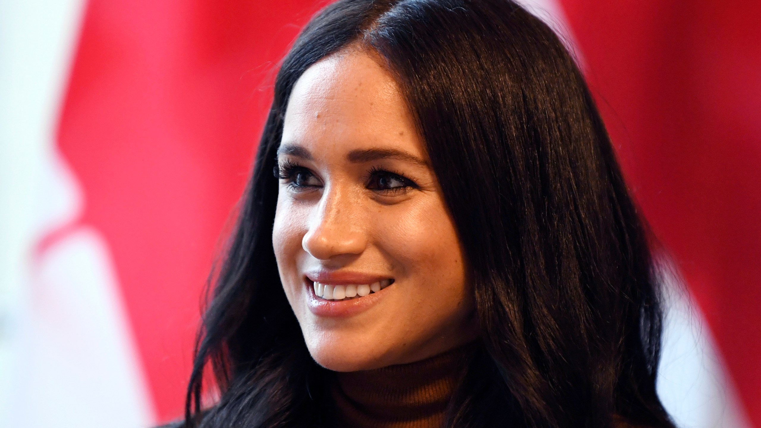 In this Jan. 7, 2020 file photo, Meghan, Duchess of Sussex smiles during her visit with Prince Harry to Canada House in London. (Daniel Leal-Olivas/Pool Photo/Associated Press)