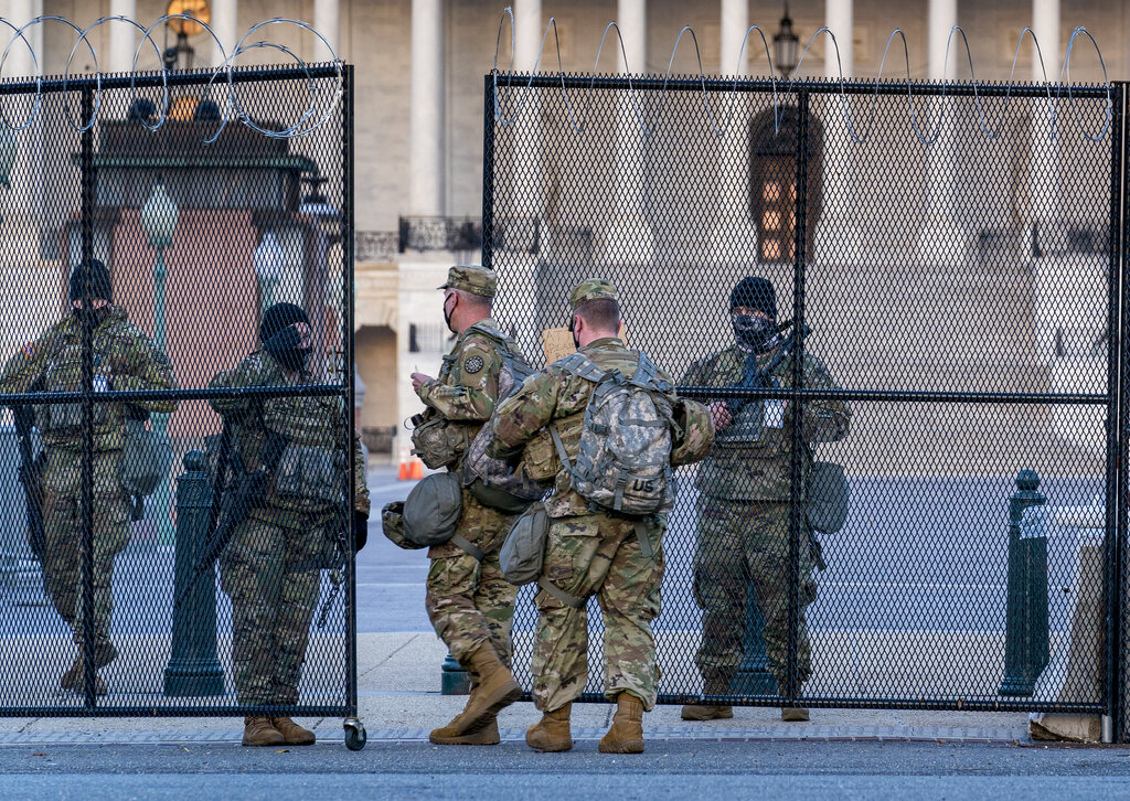 National Guard troops keep watch at the Capitol in Washington, early Thursday, March 4, 2021, amid intelligence warnings that there is a "possible plot" by a group of militia extremists to take control of the Capitol on March 4 to remove Democrats from power. (AP Photo/J. Scott Applewhite)