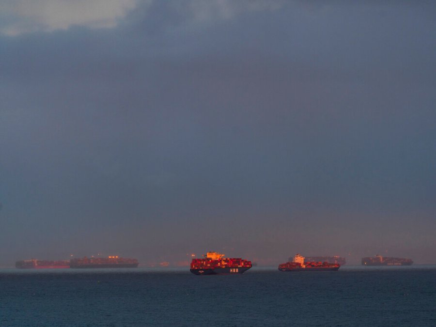 In this Wednesday, March 3, 2021 photo, a high number of container ships dot the coast of Long Beach at sunset waiting to dock at the Ports of Los Angeles and Long Beach off the California Coast. ( AP Photo/Damian Dovarganes)