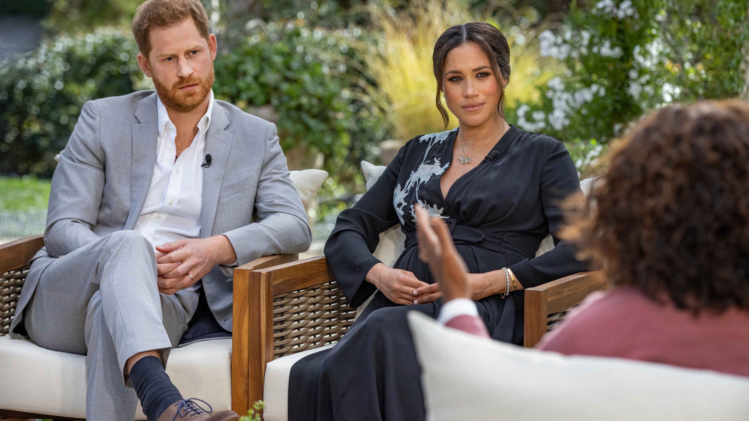 This image provided by Harpo Productions shows Prince Harry, left, and Meghan, Duchess of Sussex, in conversation with Oprah Winfrey. "Oprah with Meghan and Harry: A CBS Primetime Special" airs March 7, 2021. (Joe Pugliese/Harpo Productions via AP, File)