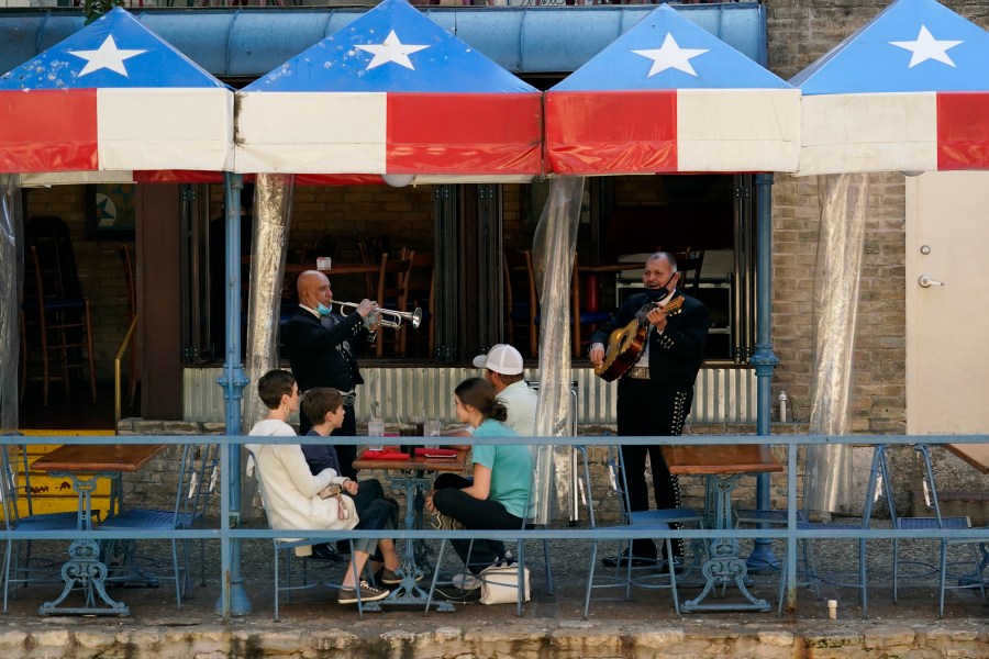 Mariachi perform for diners at a restaurant on the River Walk in San Antonio on March 3, 2021. (Eric Gay / Associated Press)