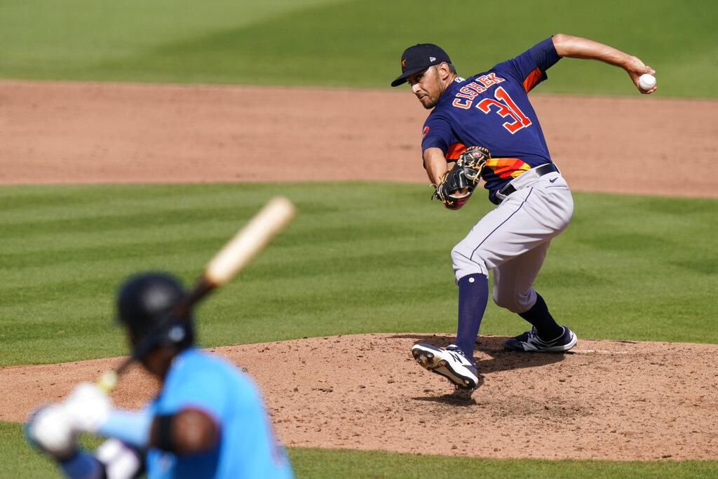 Houston Astros relief pitcher Steve Cishek (31) throws to Miami Marlins' Lewin Diaz during the seventh inning of a spring training baseball game, Friday, March 5, 2021, in Jupiter, Fla. (AP Photo/Lynne Sladky)