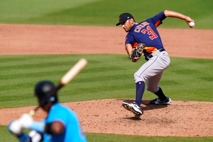 Houston Astros relief pitcher Steve Cishek (31) throws to Miami Marlins' Lewin Diaz during the seventh inning of a spring training baseball game, Friday, March 5, 2021, in Jupiter, Fla. (AP Photo/Lynne Sladky)