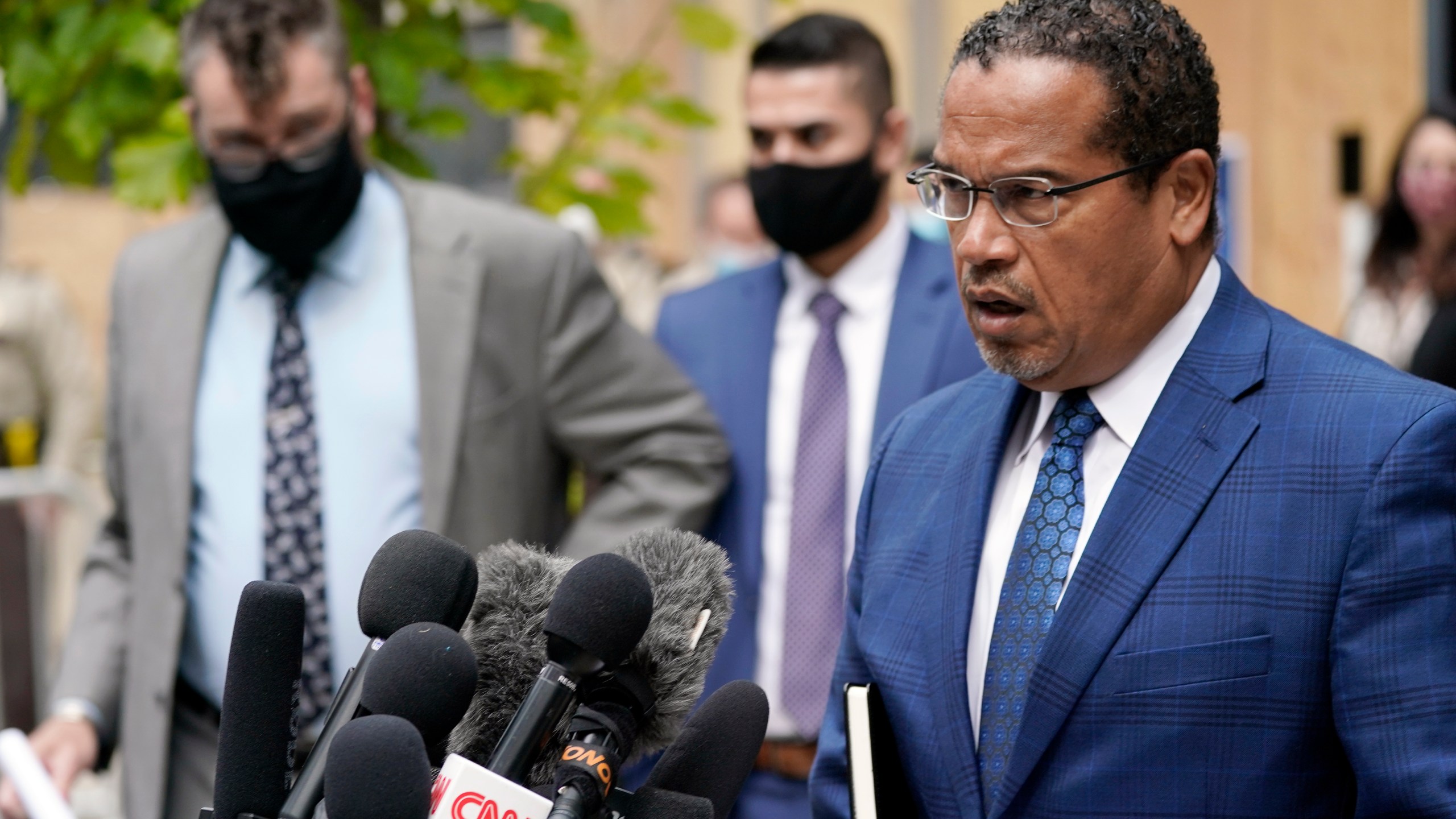 In this Sept. 11, 2020 file photo, Minnesota Attorney General Keith Ellison, right, addresses reporters outside the Hennepin County Family Justice Center in Minneapolis. (AP Photo/Jim Mone, File)In this Sept. 11, 2020 file photo, Minnesota Attorney General Keith Ellison, right, addresses reporters outside the Hennepin County Family Justice Center in Minneapolis. (AP Photo/Jim Mone, File)