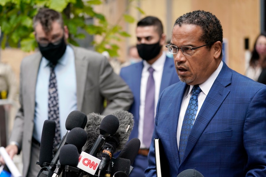 In this Sept. 11, 2020 file photo, Minnesota Attorney General Keith Ellison, right, addresses reporters outside the Hennepin County Family Justice Center in Minneapolis. (AP Photo/Jim Mone, File)In this Sept. 11, 2020 file photo, Minnesota Attorney General Keith Ellison, right, addresses reporters outside the Hennepin County Family Justice Center in Minneapolis. (AP Photo/Jim Mone, File)