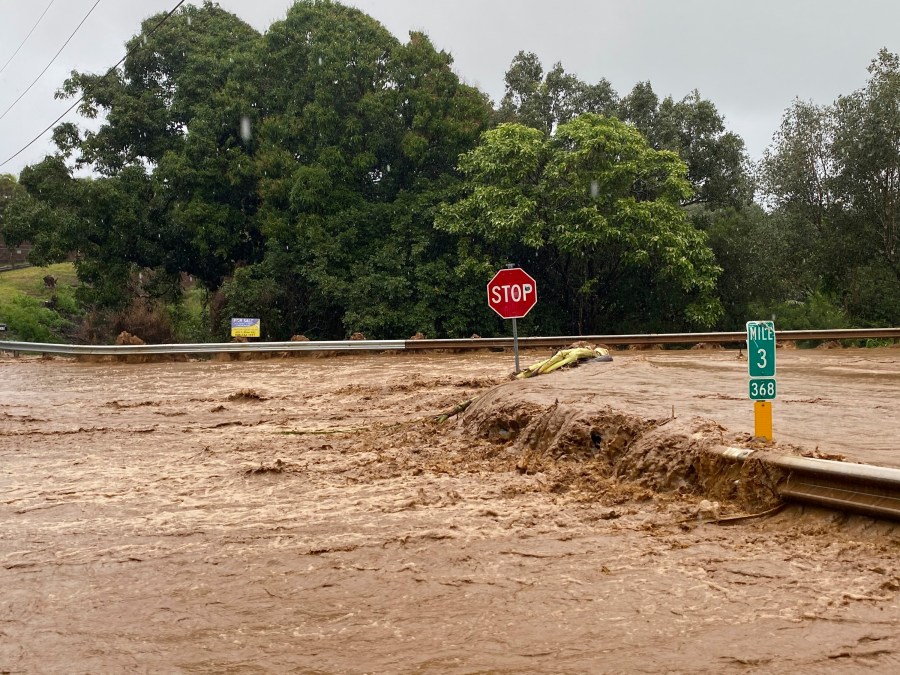 Floodwaters sweep over Hana Highway near West Kuiaha Road in Haiku, Maui, Hawaii, on Monday, March 8, 2021. (Kehaulani Cerizo/The Maui News via AP)