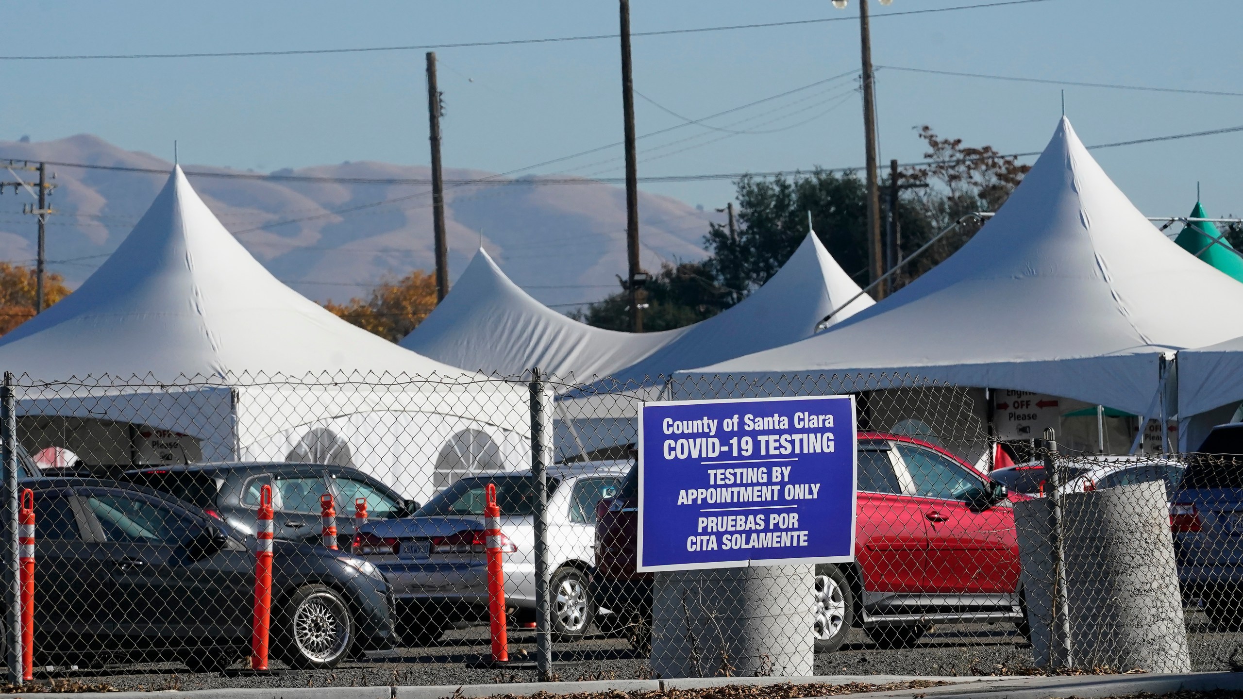 Cars line up at a Santa Clara County COVID-19 testing site in San Jose during the coronavirus pandemic on Dec. 1, 2020. (Jeff Chiu / Associated Press)