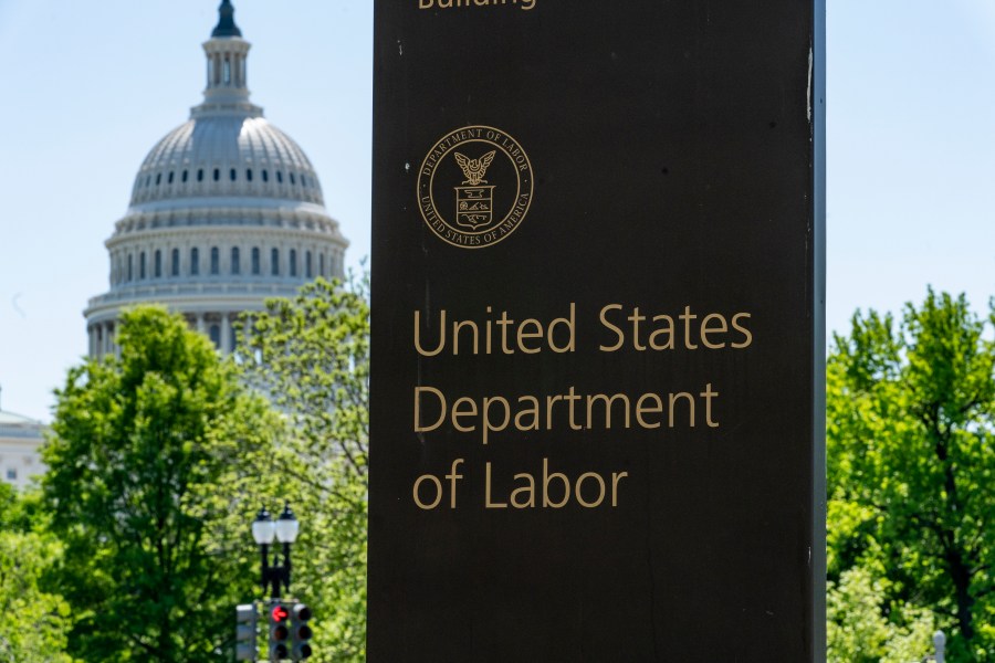 In this May 7, 2020, file photo, the entrance to the Labor Department is seen near the Capitol in Washington. Unemployment fraud in the U.S. has reached dramatic levels during the pandemic: more than $63 billion has been paid out improperly through fraud or errors since March 2020. Criminals are seizing on the opportunity created by the pandemic and are making false claims using stolen information. (AP Photo/J. Scott Applewhite, File)