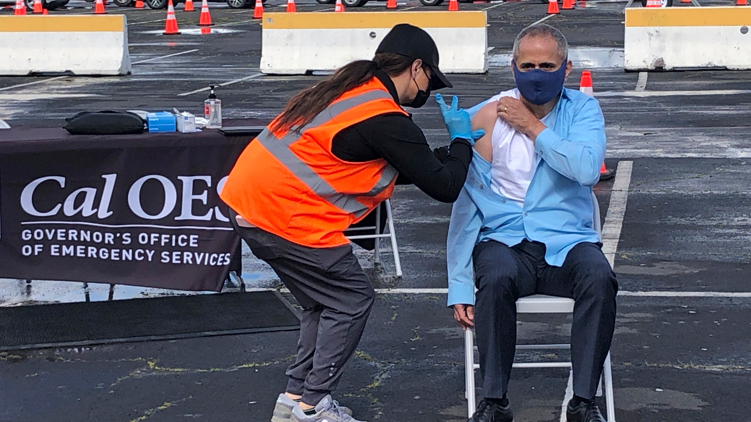 Dr. Tomas Aragon, State Public Health Officer and California Department of Public Health Director, takes part in a vaccination event at the RingCentral Coliseum in Oakland, Calif., on Thursday, March 11, 2021, to highlight the new one-dose Janssen COVID-19 vaccine by Johnson & Johnson. (AP Photo/Haven Daley)