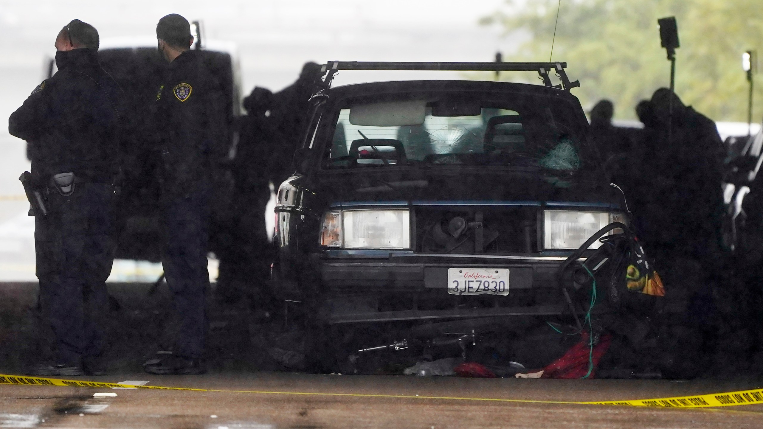 A car involved in a deadly accident sits at the scene in San Diego on March 15, 2021. (Gregory Bull / Associated Press)