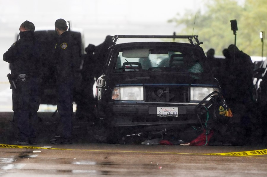 A car involved in a deadly accident sits at the scene in San Diego on March 15, 2021. (Gregory Bull / Associated Press)