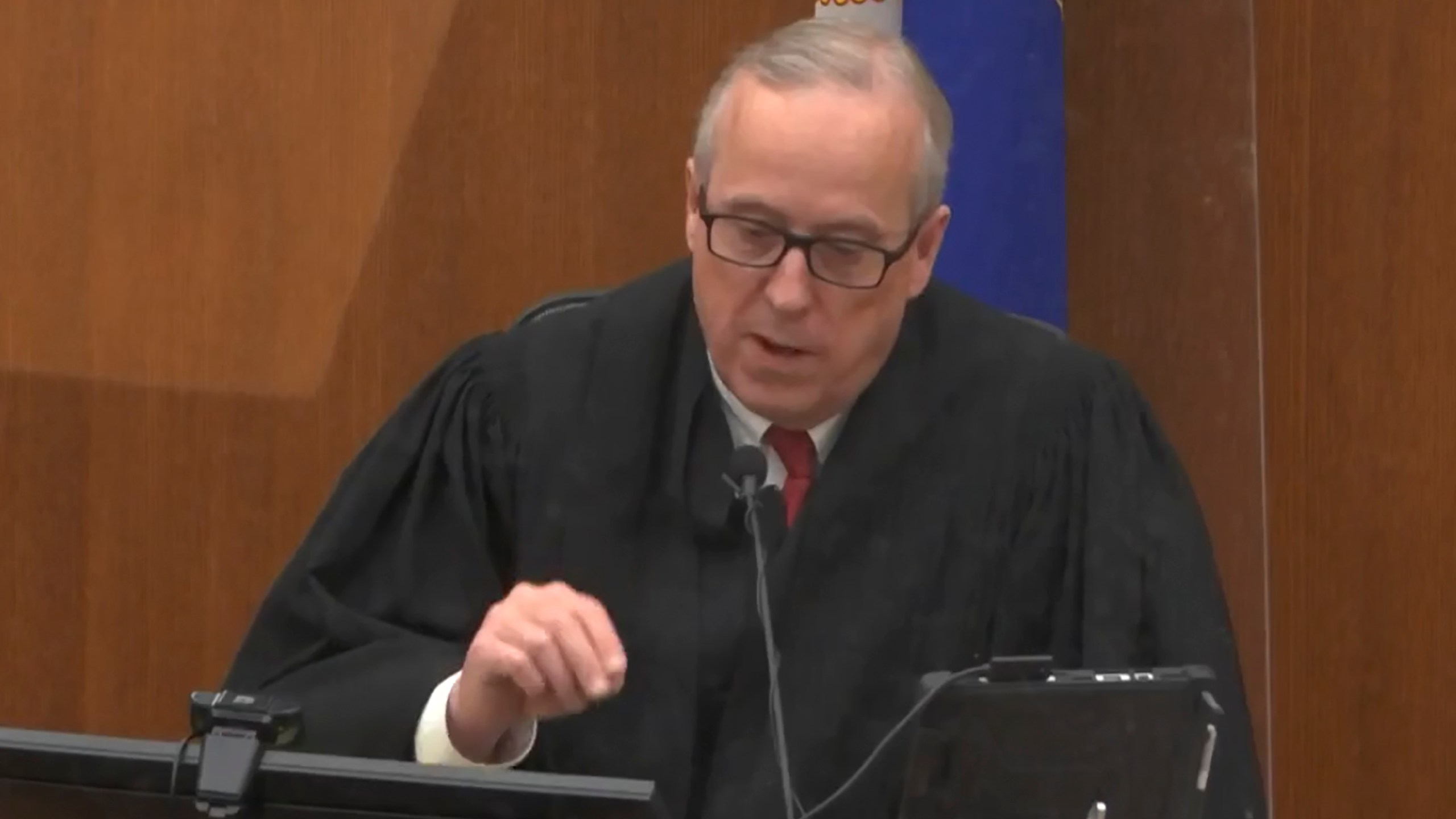 In this screen grab from video, Hennepin County Judge Peter Cahill presides over jury selection, Wednesday, March 17, 2021, in the trial of former Minneapolis police officer Derek Chauvin, in the May 25, 2020, death of George Floyd at the Hennepin County Courthouse in Minneapolis, Minn. The Judge dismissed a juror seated for ex-officer's trial who said $27M settlement to Floyd family would skew judgment. (Court TV, via AP, Pool)