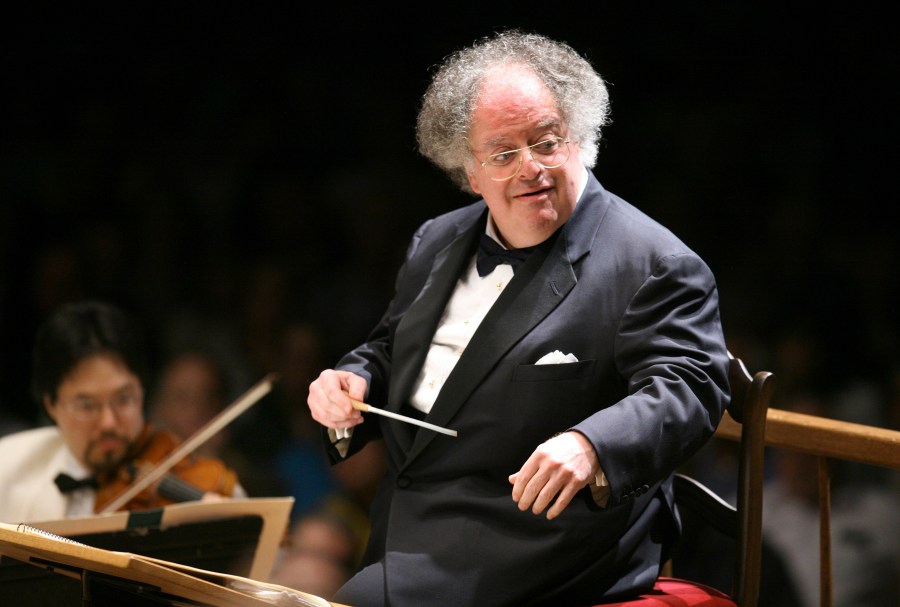 Boston Symphony Orchestra music director James Levine conducts the symphony on its opening night performance at Tanglewood in Lenox, Mass. on July 7, 2006. Levine, who ruled over the Metropolitan Opera for 4 1/2 decades before being eased out when his health declined and then fired for sexual improprieties, died March 9, 2021 in Palm Springs. (Michael Dwyer/Associated Press)