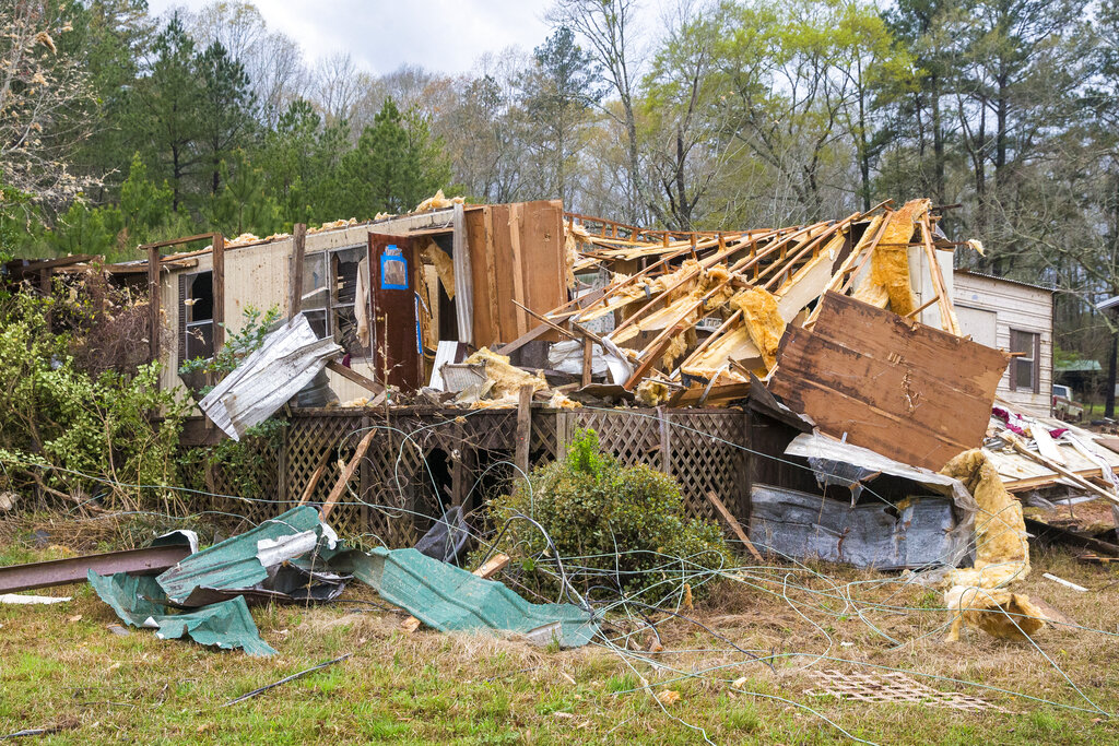 Damage to Bobbi Harris' property on Old Greensboro Road is seen, Wednesday, March 17, 2021, in Moundville, Ala., after severe weather came through the area. No one was inside at the time. (AP Photo/Vasha Hunt)