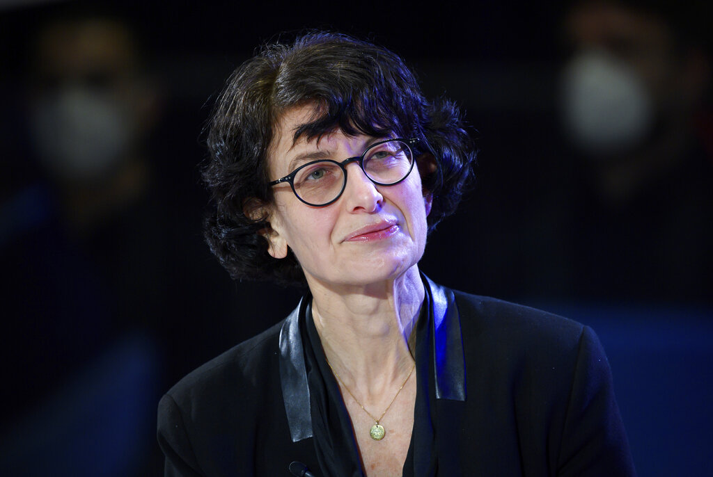 Ozlem Tureci, co-founder of the Mainz-based coronavirus vaccine developer BioNTech, listens during an Axel Springer Award ceremony broadcast on the Internet, Thursday, March 18, 2021. (Bernd von Jutrczenka/dpa via AP, Pool)