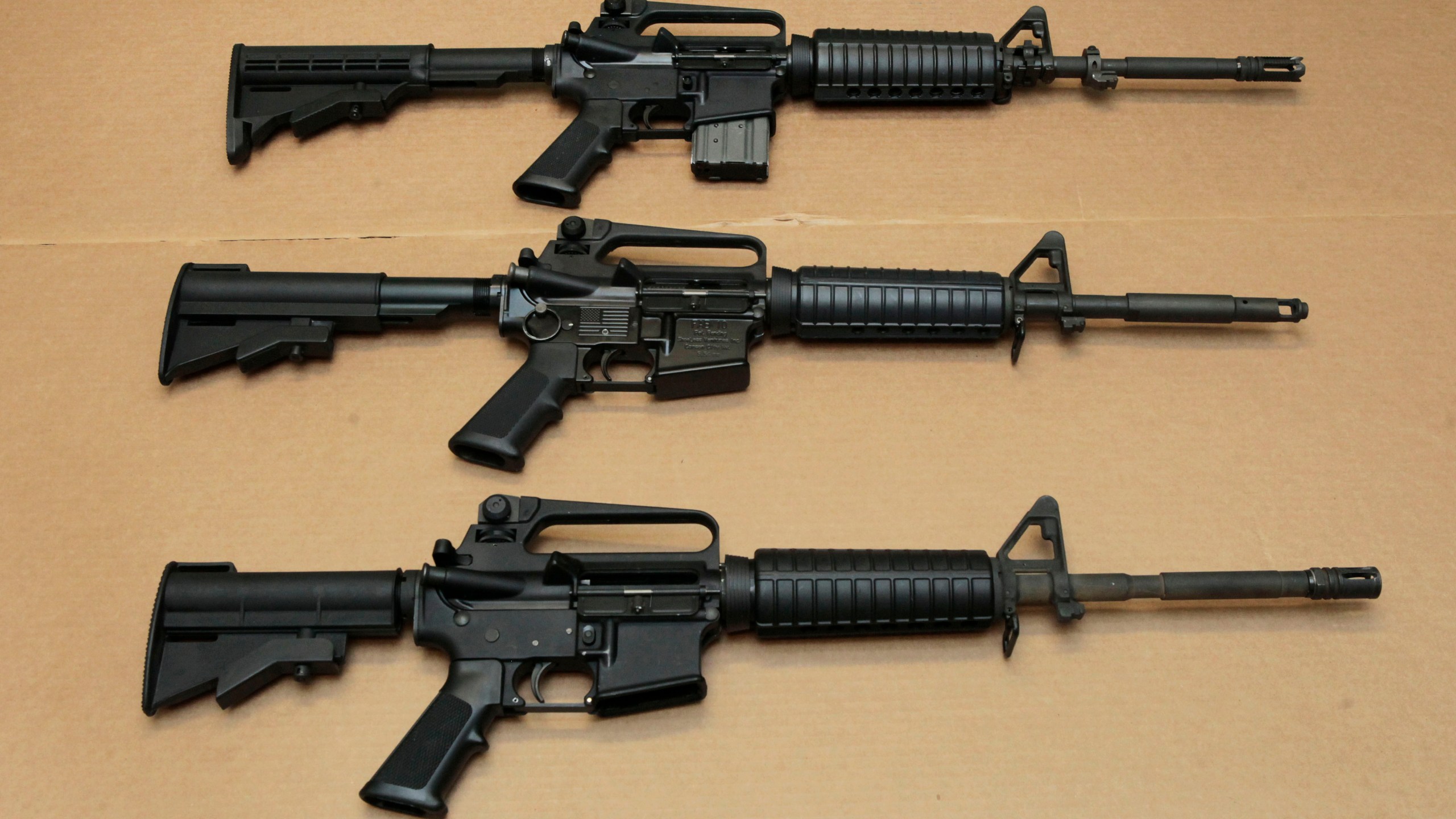 In this Aug. 15, 2012 file photo, three variations of the AR-15 assault rifle are displayed at the California Department of Justice in Sacramento. (Rich Pedroncelli/Associated Press)