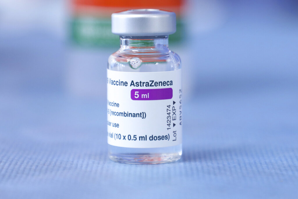 A vial of the AstraZeneca COVID-19 vaccination on a table prior to Croatia's Parliament Speaker Gordan Jandrokovic and Prime Minister Andrej Plenkovic being vaccinated, in Zagreb, Croatia, Wednesday, March 24, 2021. (Admir Buljubasic/Pool via AP)