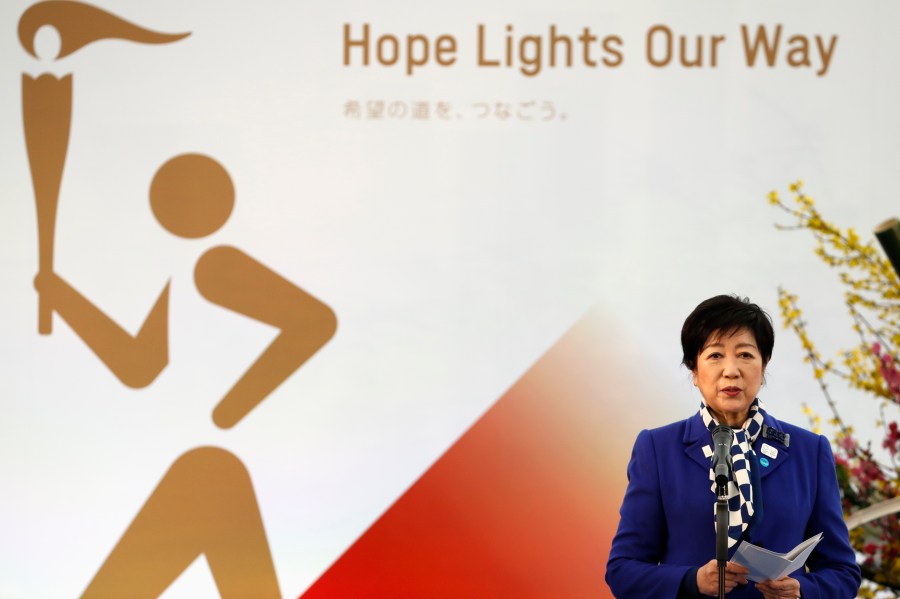 Tokyo Gov. Yuriko Koike delivers a speech during the Grand Start of the Olympic Torch Relay in Naraha, Fukushima prefecture, northeastern Japan, Thursday, March 25, 2021. (Kim Kyung-Hoon/Pool Photo via AP)