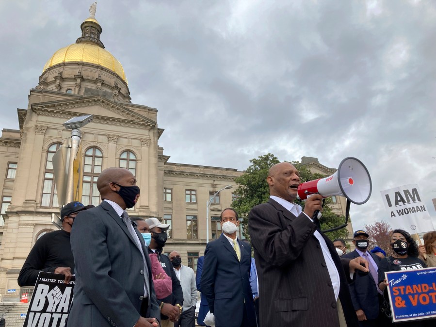 African Methodist Episcopal Church Bishop Reginald Jackson announces a boycott of Coca-Cola Co. products outside the Georgia Capitol on Thursday, March 25, 2021 in Atlanta. Jackson says Coca-Cola and other large Georgia companies haven't done enough to oppose restrictive voting bills that Georgia lawmakers were debating as Jackson spoke. (Jeff Amy/Associated Press)