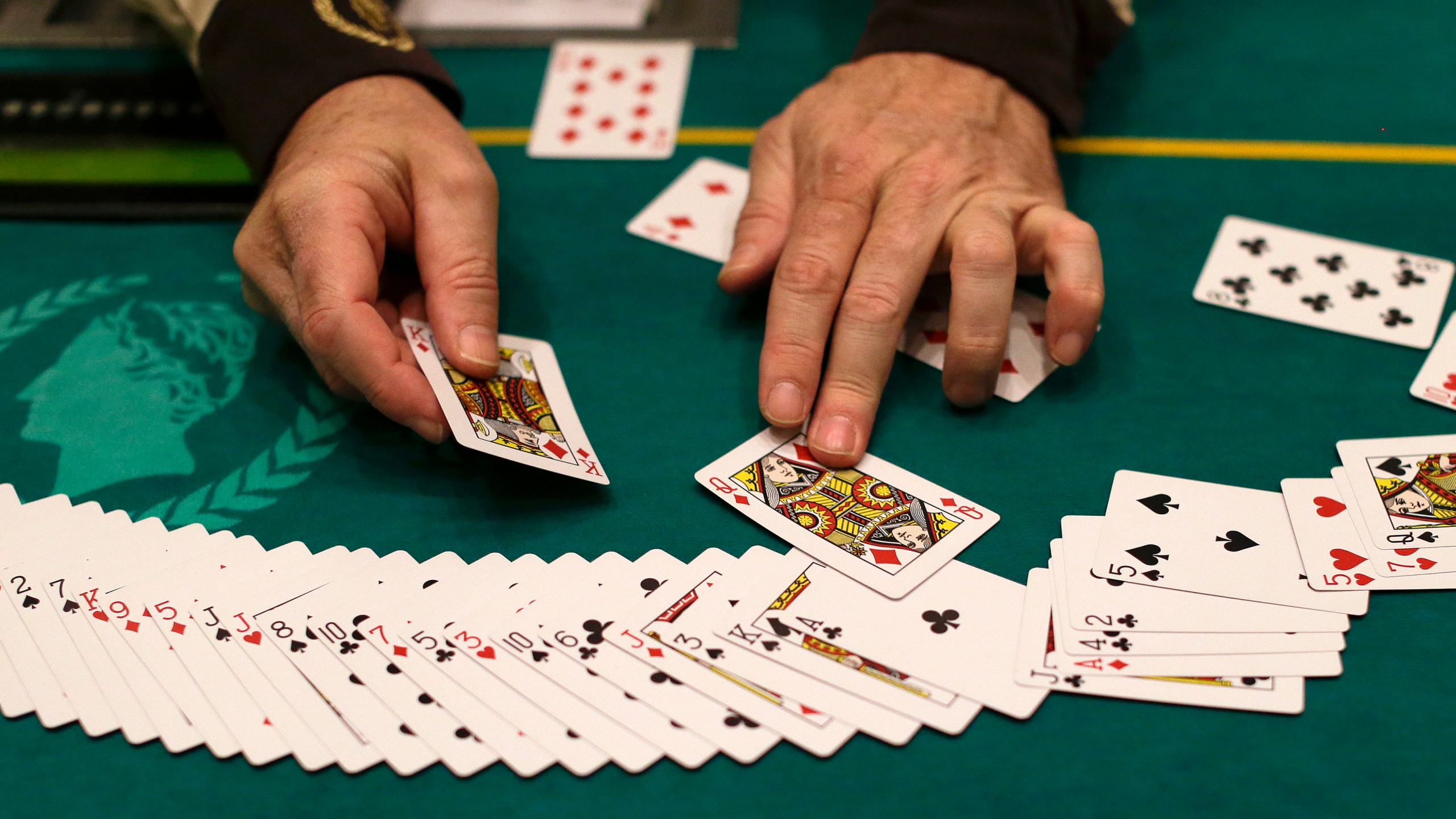 In this Feb. 27, 2013 file photo Jeff Martos resets a deck of cards during a break in poker play at Caesar's Palace, in Las Vegas. (AP Photo/Julie Jacobson, File)