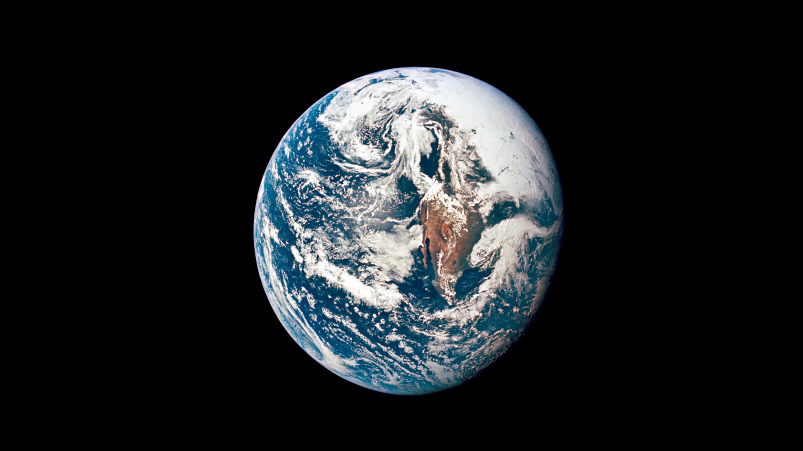 This May 18, 1969 photo made available by NASA shows Earth from 36,000 nautical miles away as photographed from the Apollo 10 spacecraft during its trans-lunar journey toward the moon. In March 2021, the U.S. space agency announced that new telescope observations have ruled out any chance of the asteroid Apophis colliding with Earth in 2068. (NASA via AP)