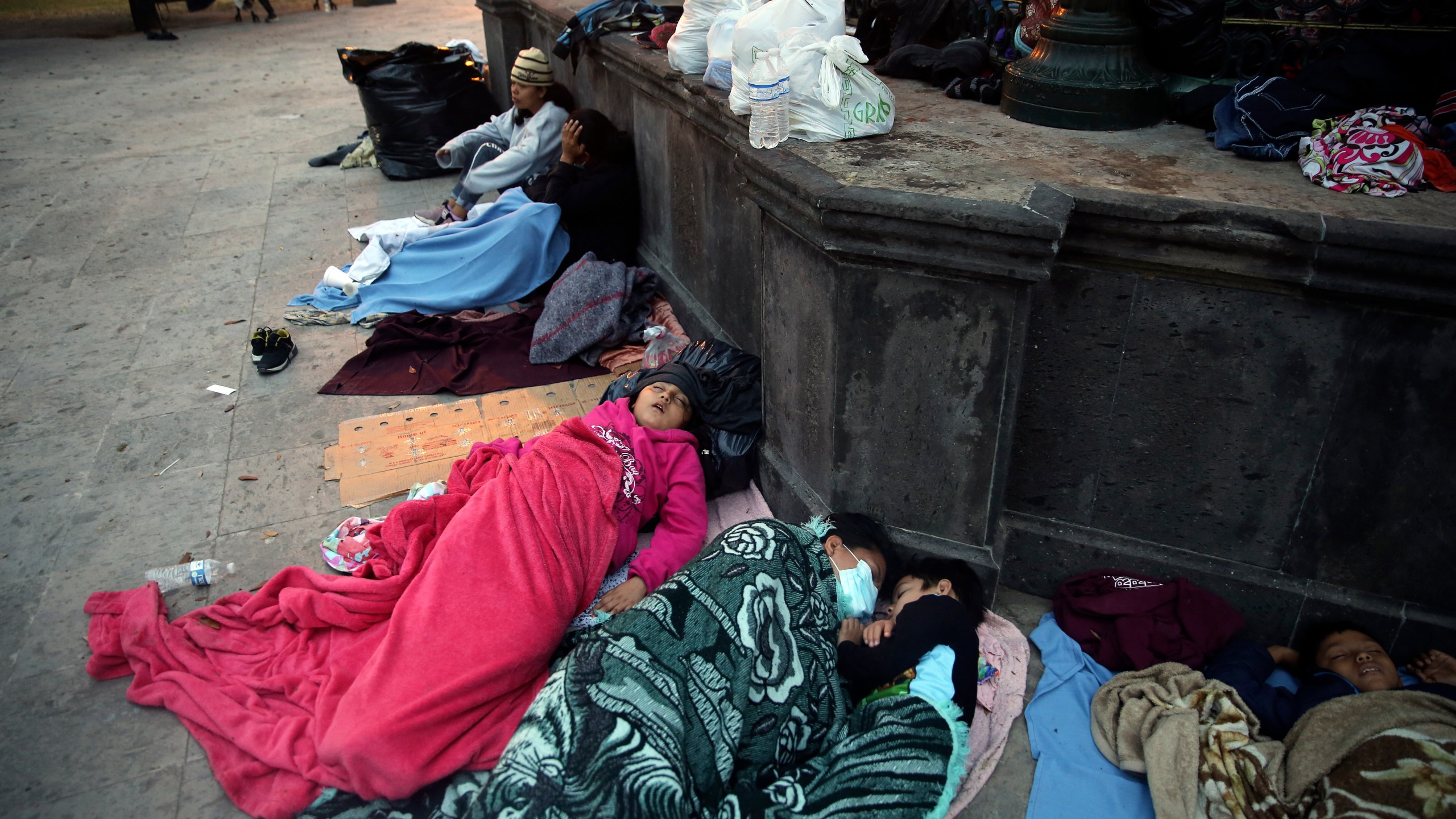 Migrants sleep under a gazebo at a park in the Mexican border city of Reynosa, Saturday, March 27, 2021. (AP Photo/Dario Lopez-Mills)